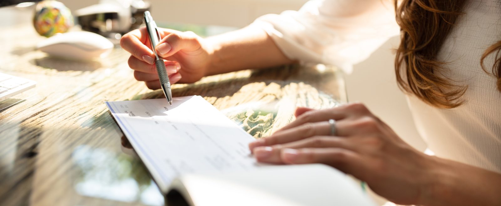 Person writing a check.