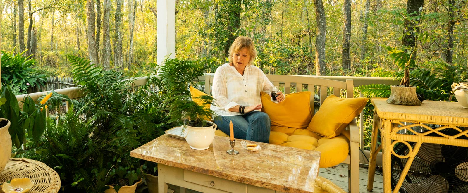 Woman sitting on her porch.