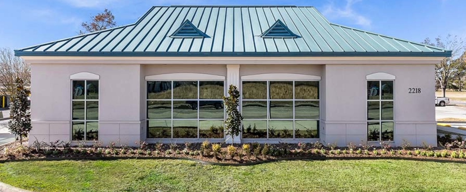 Side of Lafayette Branch with Landscape and Large windows.