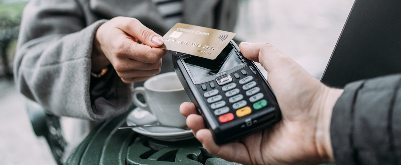 Person paying with credit card.