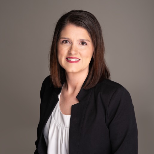 Michele in white blouse with black jacket.