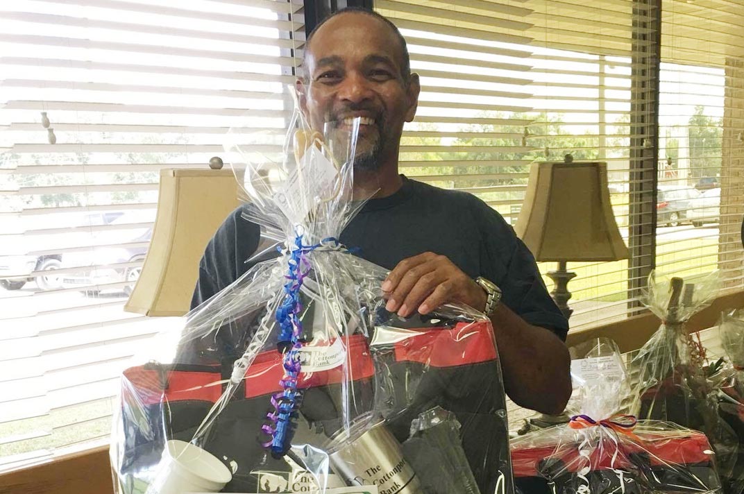 Man holding a gift basket