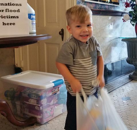 Happy kid with a shopping bag